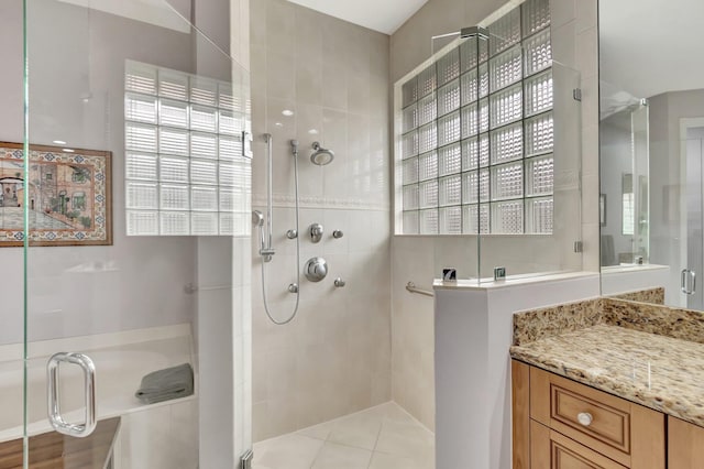 full bathroom with a stall shower and vanity