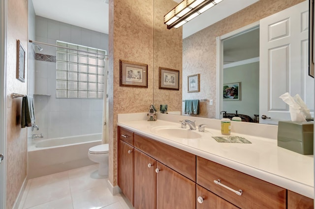 bathroom with baseboards, toilet, vanity, tile patterned flooring, and shower / bathtub combination