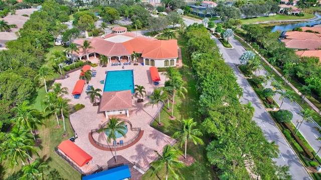 birds eye view of property with a water view