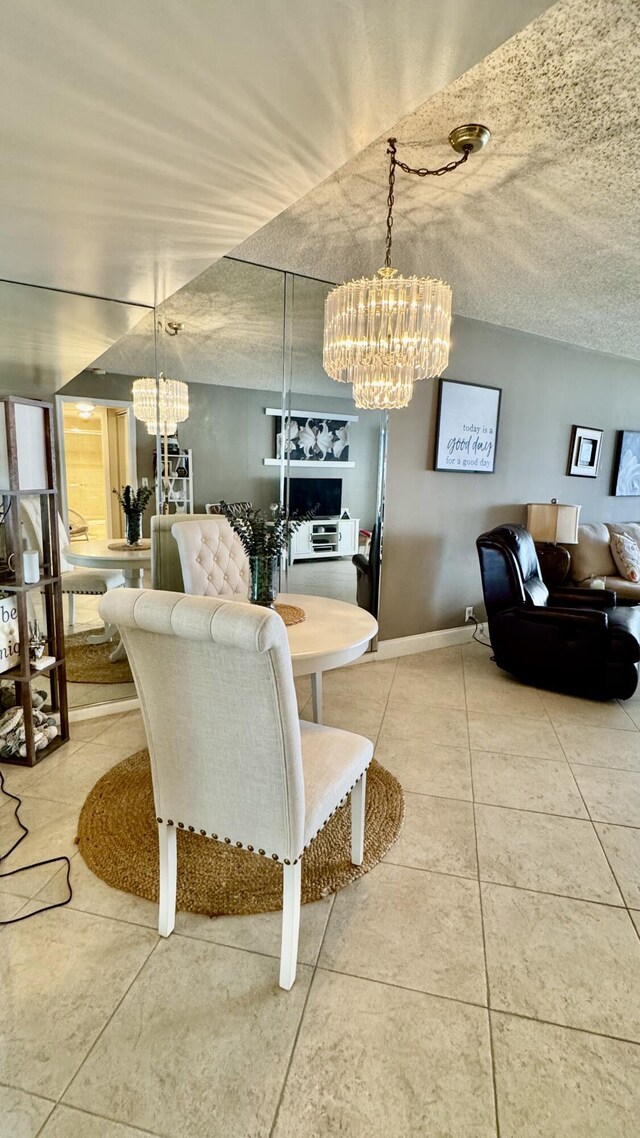 living area featuring light tile patterned flooring and a textured ceiling