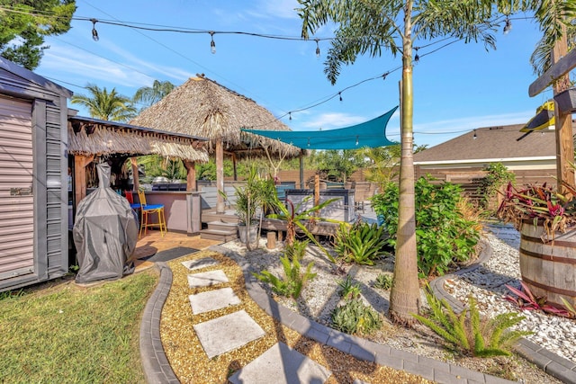 view of yard featuring a jacuzzi and a deck