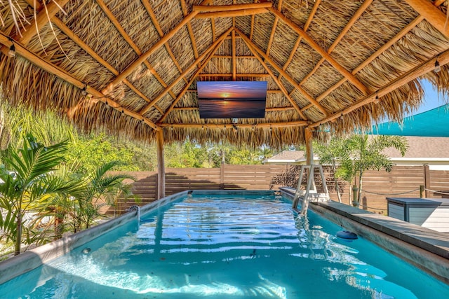 view of pool featuring a gazebo, a fenced in pool, and a fenced backyard