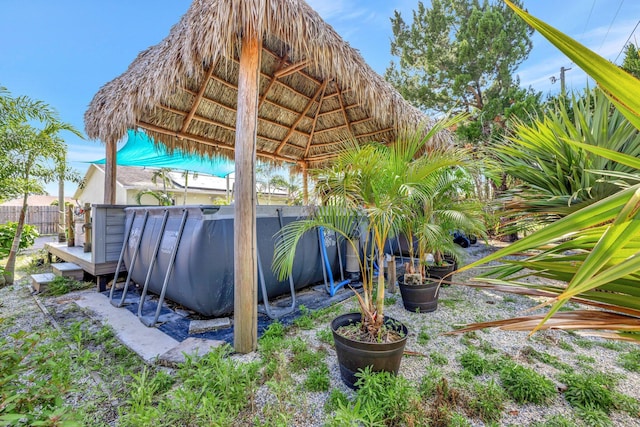 exterior space featuring fence and a gazebo