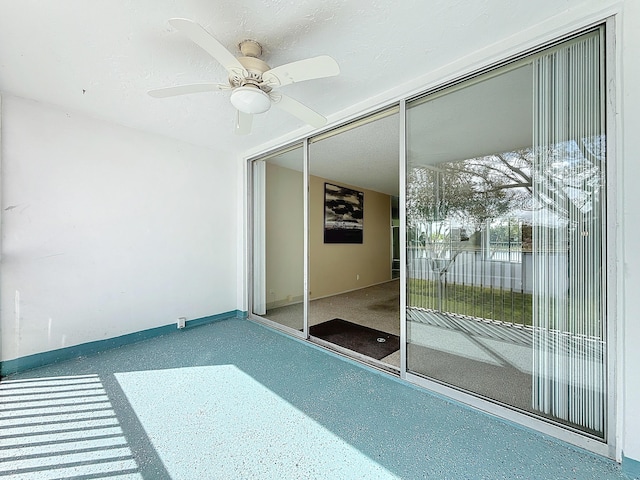 interior space featuring a ceiling fan