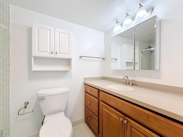 full bathroom with an enclosed shower, vanity, and toilet