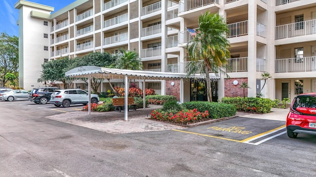 view of building exterior featuring uncovered parking