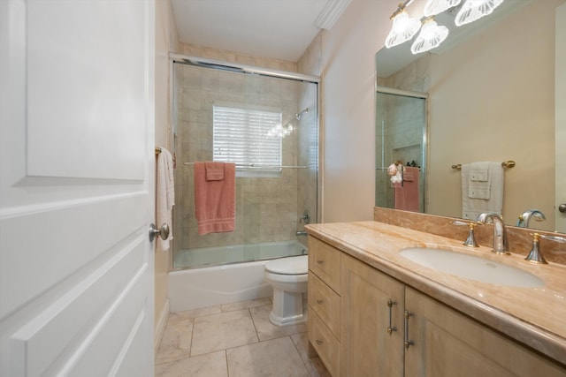 full bathroom with toilet, bath / shower combo with glass door, tile patterned flooring, and vanity