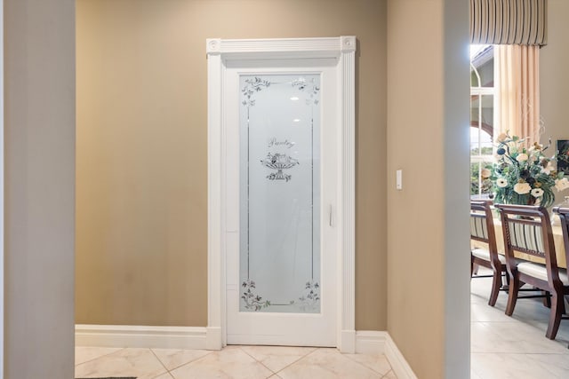 bathroom with tile patterned flooring and baseboards