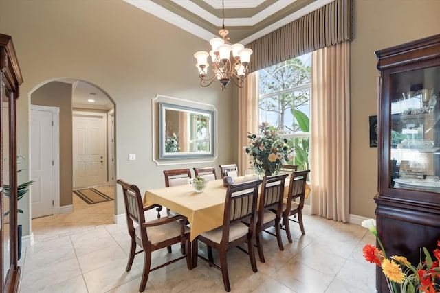 dining area featuring arched walkways, ornamental molding, light tile patterned floors, and an inviting chandelier