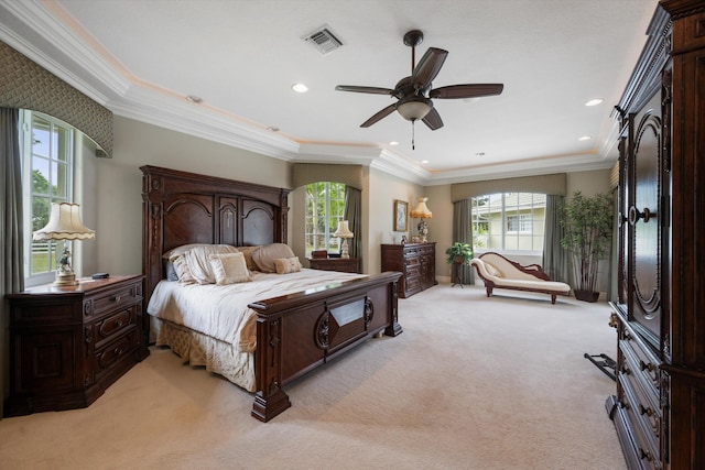 bedroom with recessed lighting, visible vents, ornamental molding, and light colored carpet