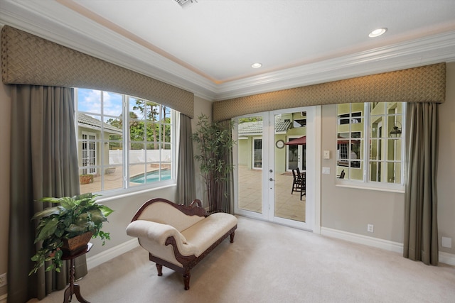 sitting room featuring carpet, crown molding, baseboards, and recessed lighting