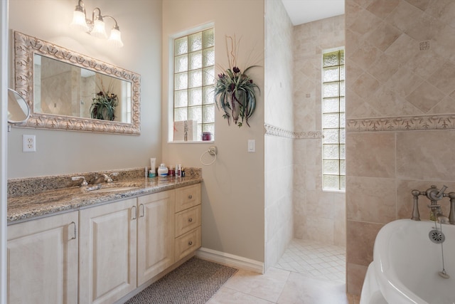 bathroom featuring a freestanding bath, walk in shower, vanity, and a healthy amount of sunlight