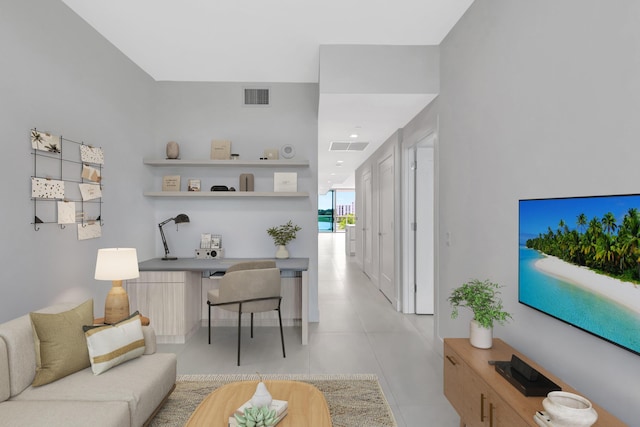 living room featuring visible vents and light tile patterned floors