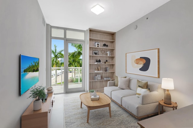 living area with concrete flooring and expansive windows