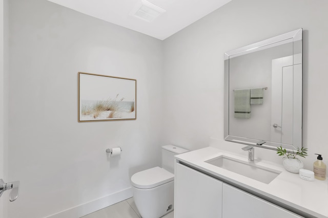 bathroom with tile patterned flooring, toilet, visible vents, vanity, and baseboards