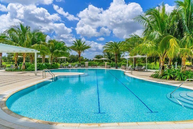 community pool with a patio area