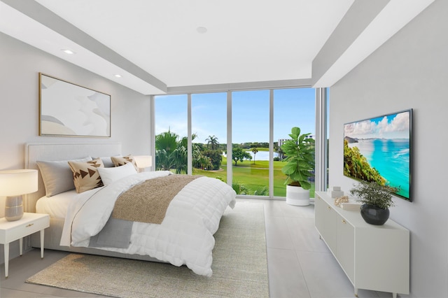 bedroom with light tile patterned floors, a wall of windows, and recessed lighting