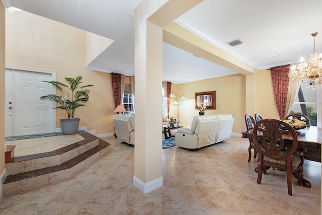 interior space with a notable chandelier, visible vents, crown molding, and baseboards