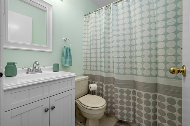 bathroom with vanity, toilet, and tile patterned floors