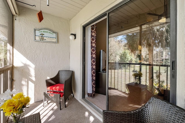 exterior space featuring a balcony and stucco siding