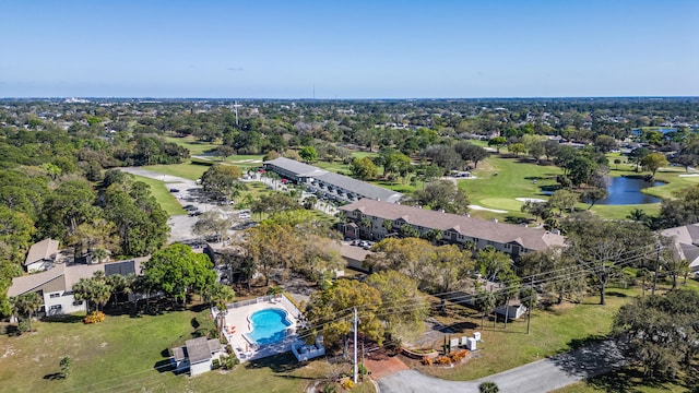 birds eye view of property with a water view and a residential view