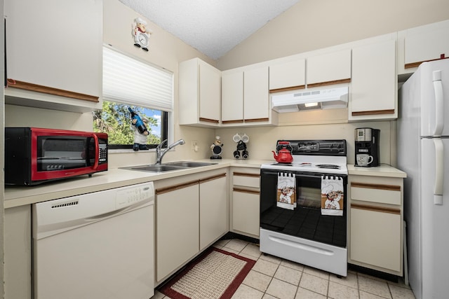 kitchen with light countertops, white cabinets, a sink, white appliances, and under cabinet range hood