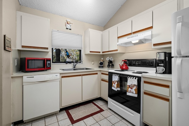 kitchen featuring white appliances, light countertops, a sink, and under cabinet range hood