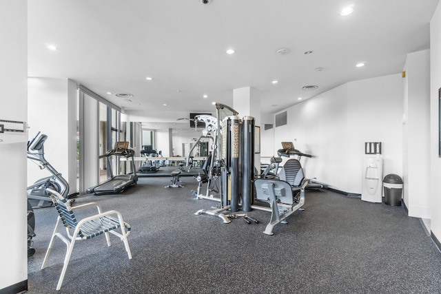 gym with baseboards and recessed lighting