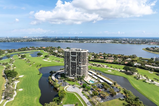 birds eye view of property featuring golf course view and a water view