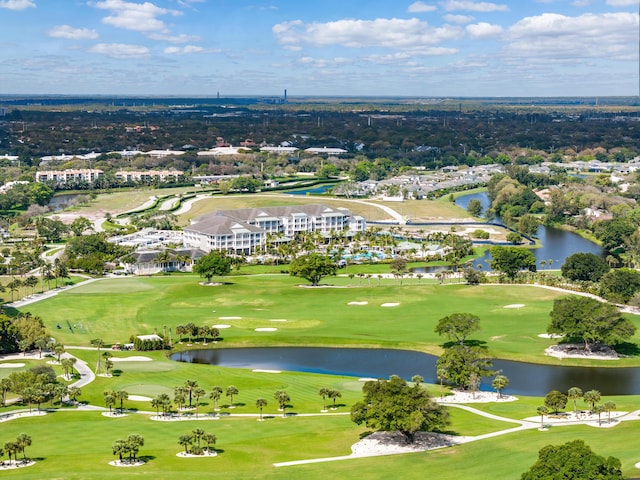 bird's eye view with view of golf course and a water view