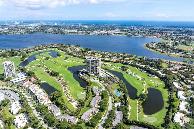 bird's eye view featuring view of golf course, a water view, and a city view