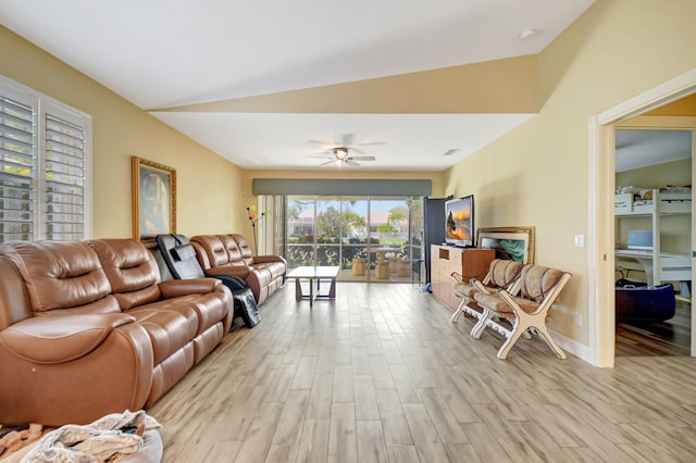 living room with light wood-type flooring, vaulted ceiling, and ceiling fan