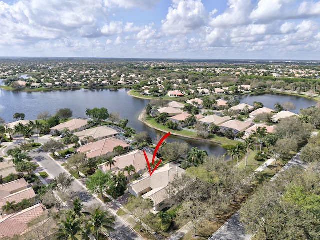 birds eye view of property with a residential view and a water view