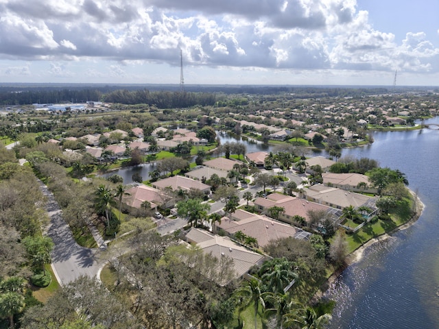 bird's eye view featuring a water view and a residential view