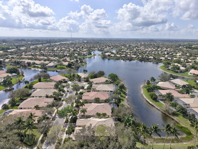 drone / aerial view with a residential view and a water view