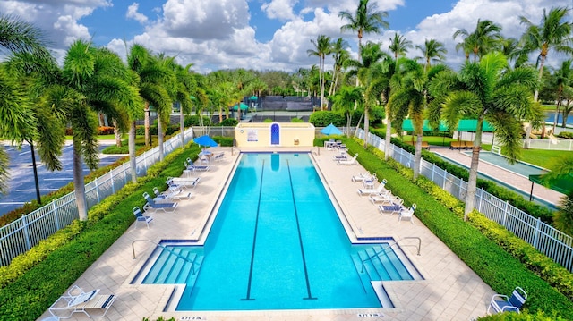 pool featuring a patio and fence