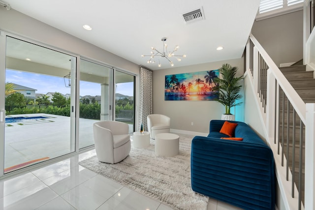 sitting room featuring recessed lighting, visible vents, baseboards, stairway, and an inviting chandelier