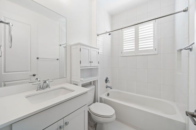 bathroom featuring shower / bathtub combination, toilet, and vanity