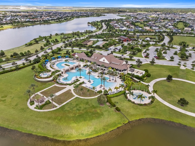birds eye view of property with a residential view and a water view