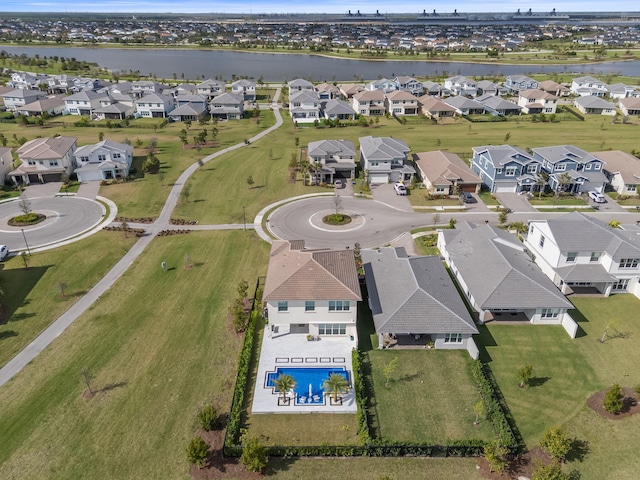 bird's eye view with a residential view and a water view