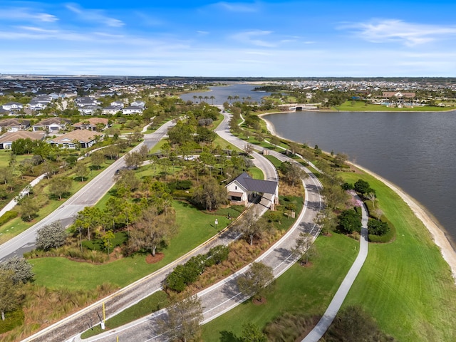 bird's eye view featuring a water view and a residential view