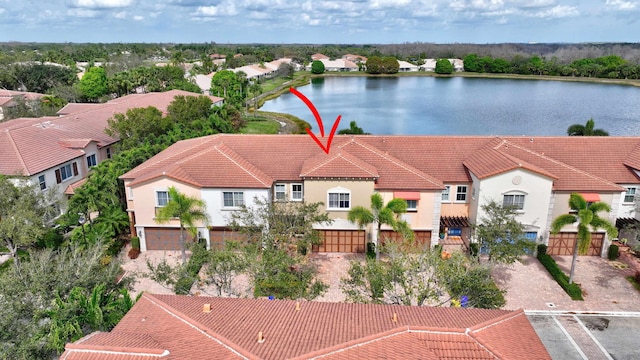 bird's eye view featuring a residential view and a water view