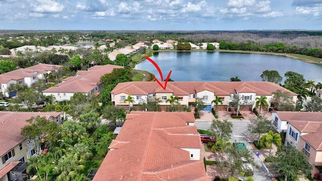 aerial view featuring a residential view and a water view