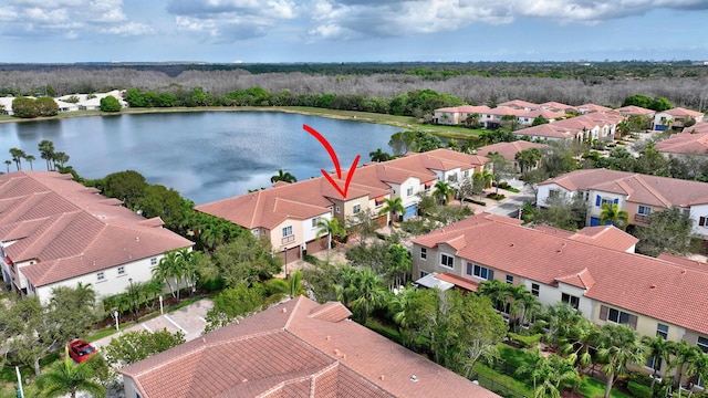 birds eye view of property featuring a water view and a residential view