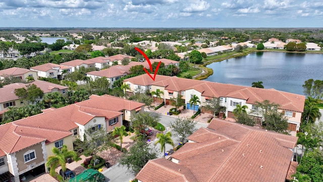 bird's eye view featuring a water view and a residential view