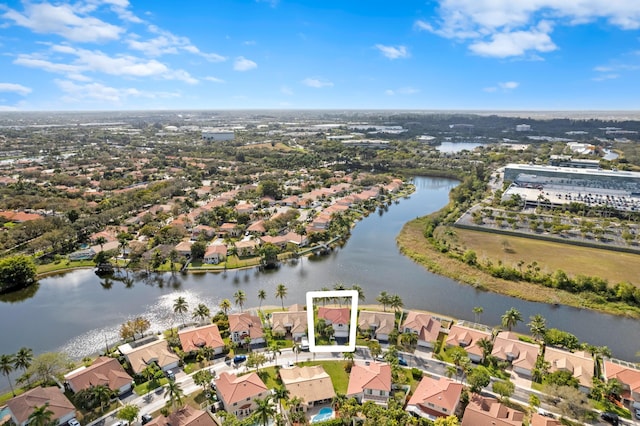 bird's eye view featuring a water view and a residential view