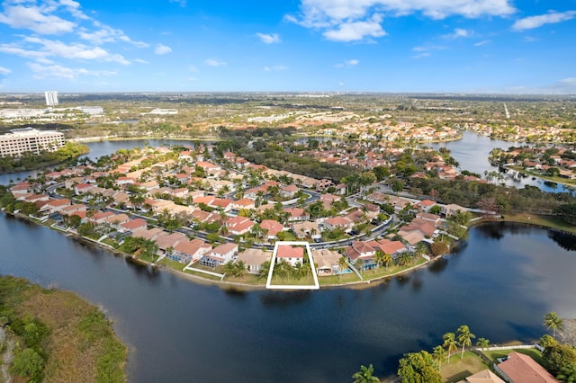 drone / aerial view featuring a water view and a residential view