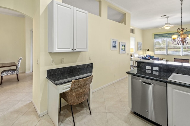 kitchen featuring arched walkways, a chandelier, dishwasher, decorative light fixtures, and white cabinetry