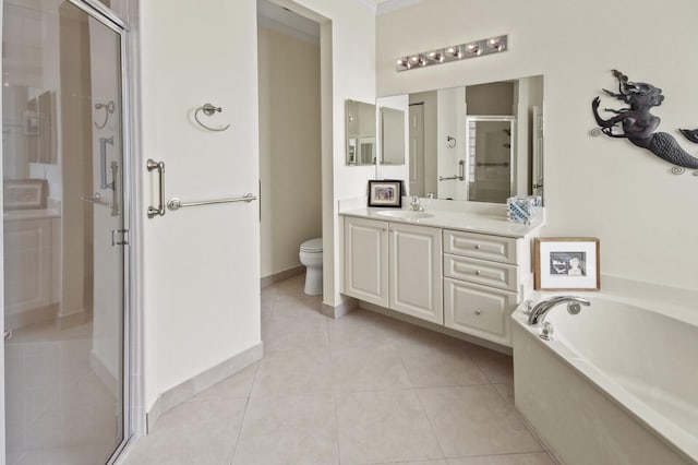 full bath with a garden tub, toilet, vanity, a shower stall, and tile patterned floors