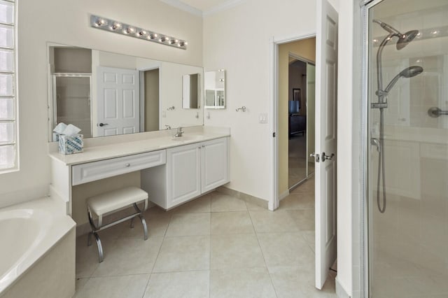 bathroom with ornamental molding, a garden tub, tile patterned flooring, vanity, and a shower stall